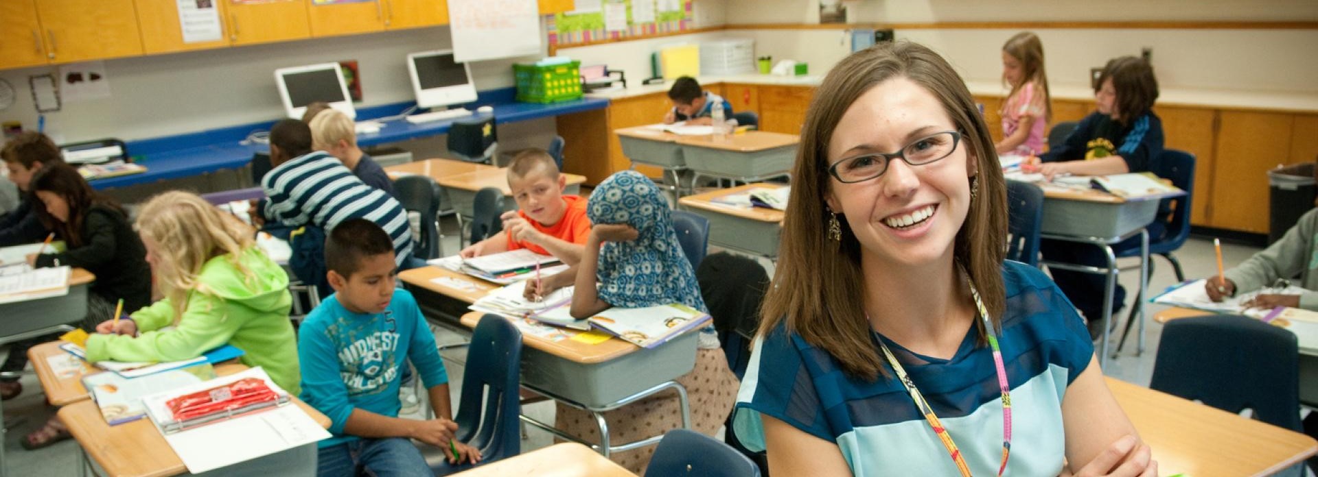 Student teacher in elementary school classroom